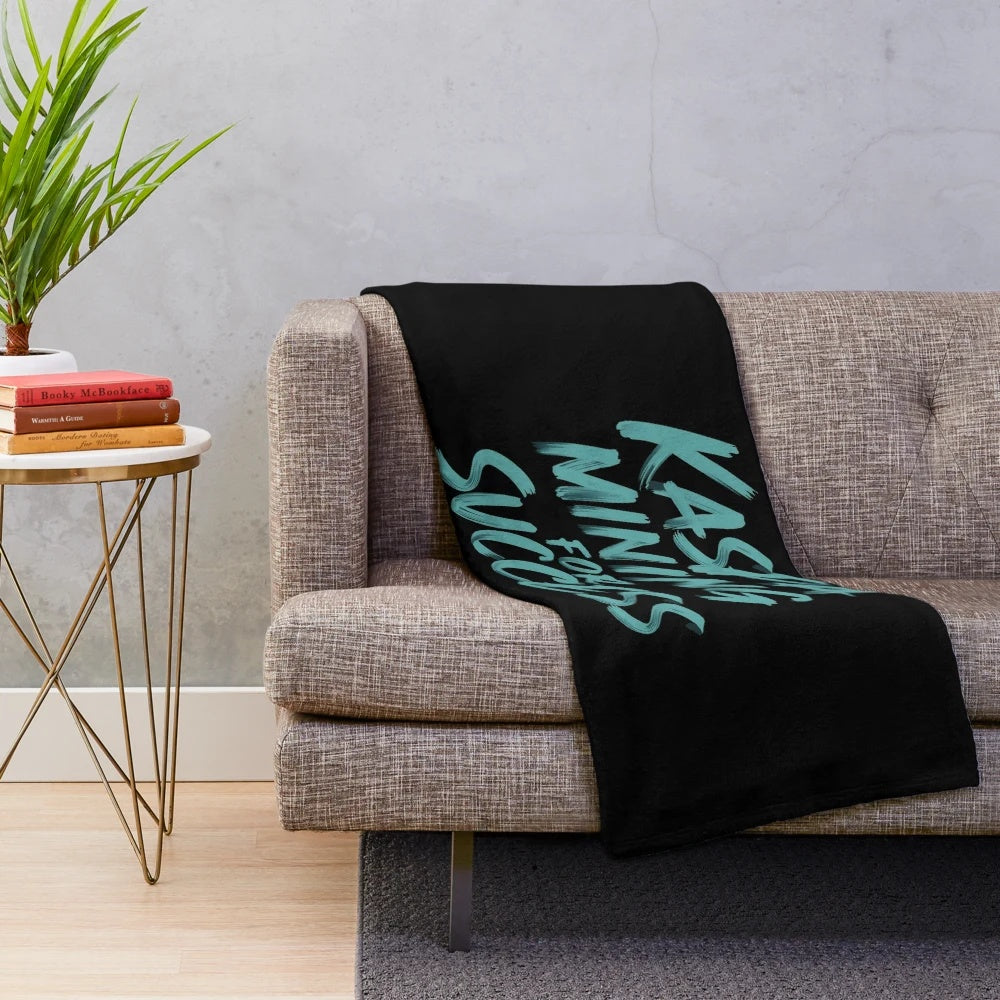 Cozy Kaspa-inspired plush blanket with cryptocurrency and blockchain motifs