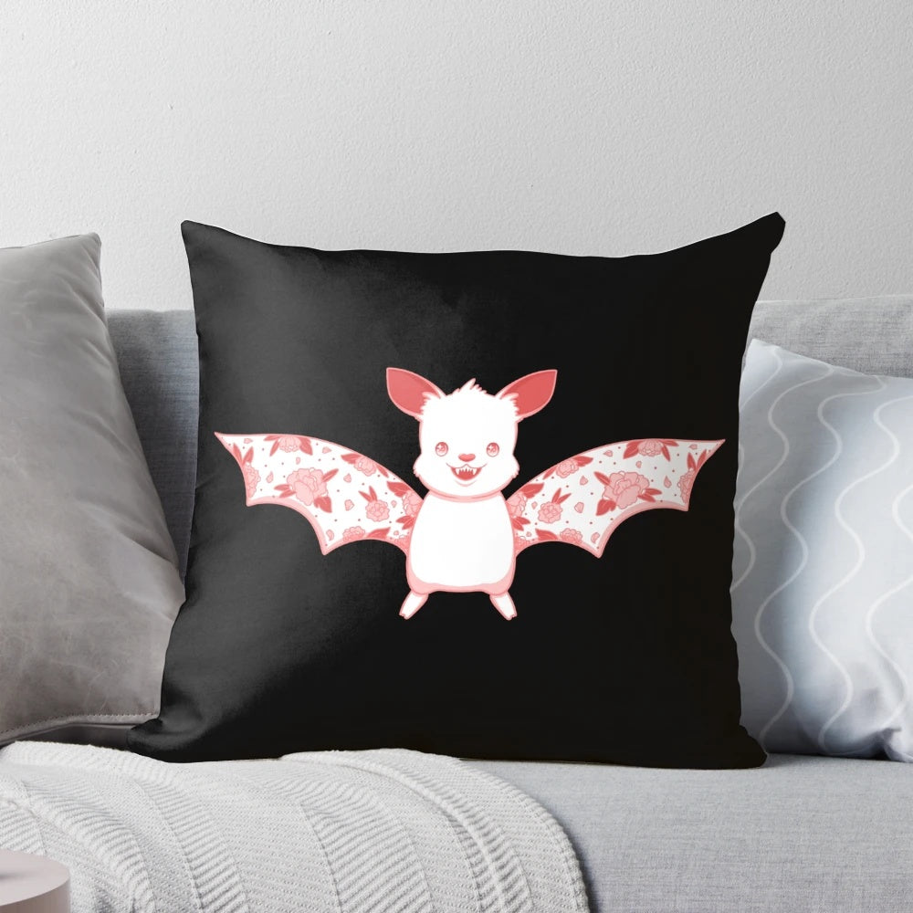 A Kawaii flower bat plush pillow in pink and white colors, perfect for a pastel goth or whimsical bedroom decor.