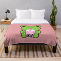 Adorable kawaii frog drinking boba tea on a plush blanket