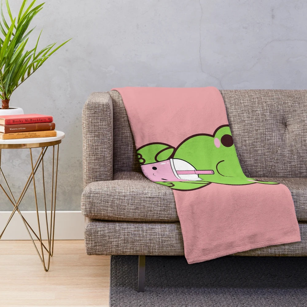 Adorable kawaii frog drinking boba tea on a plush blanket