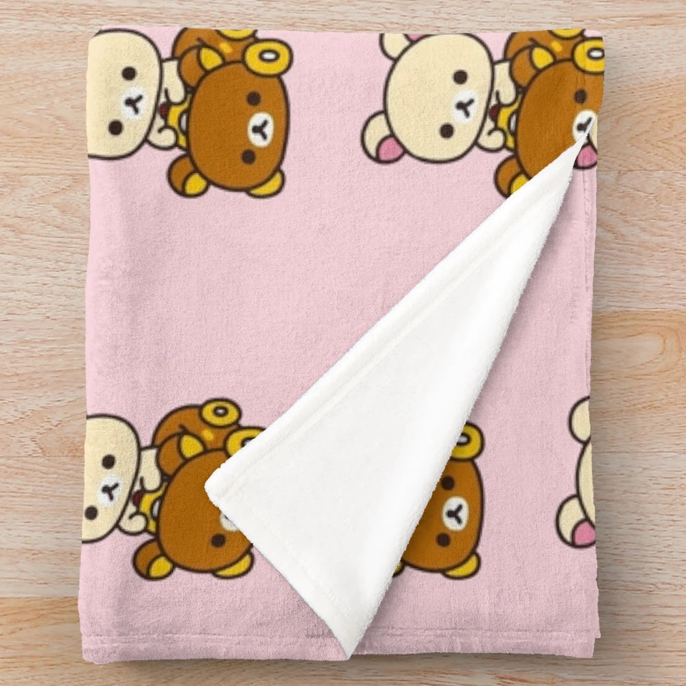 Cute plush blanket featuring Rilakkuma and Korilakkuma in a car design