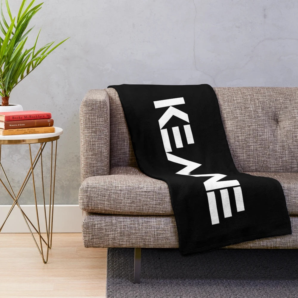 Keane-inspired plush blanket with band's logo and album art