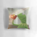 Cozy pillow with a humorous image of Kermit the Frog sipping a refreshing cup of tea.