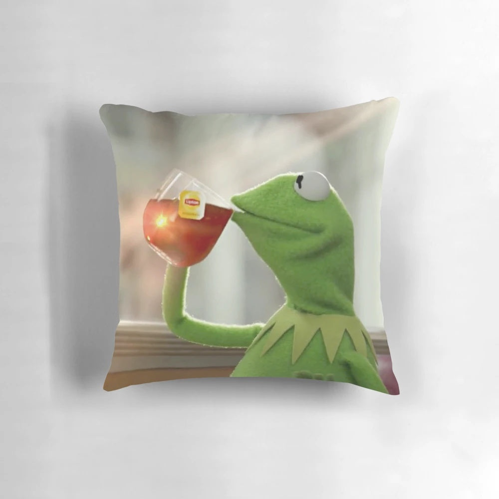 Cozy pillow with a humorous image of Kermit the Frog sipping a refreshing cup of tea.