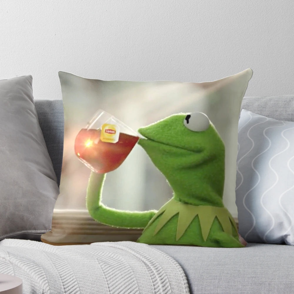 Cozy pillow with a humorous image of Kermit the Frog sipping a refreshing cup of tea.