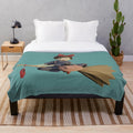 Kiki's Delivery Service inspired plush blanket featuring a cute black cat design