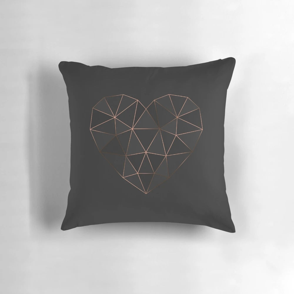 Kintsugi-inspired rose gold and metallic geometric pillow with heart-shaped design