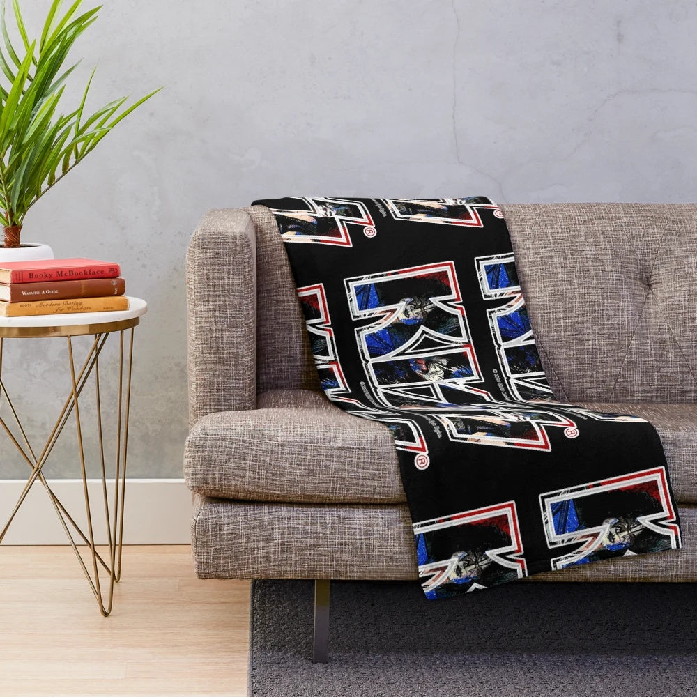 A plush blanket featuring a unique paint-style design of the iconic Kiss band logo