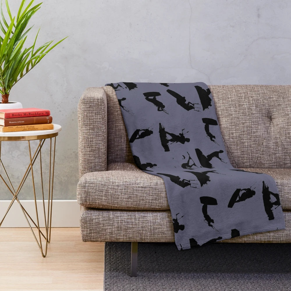 Kite surf silhouette pattern on a plush black and white blanket