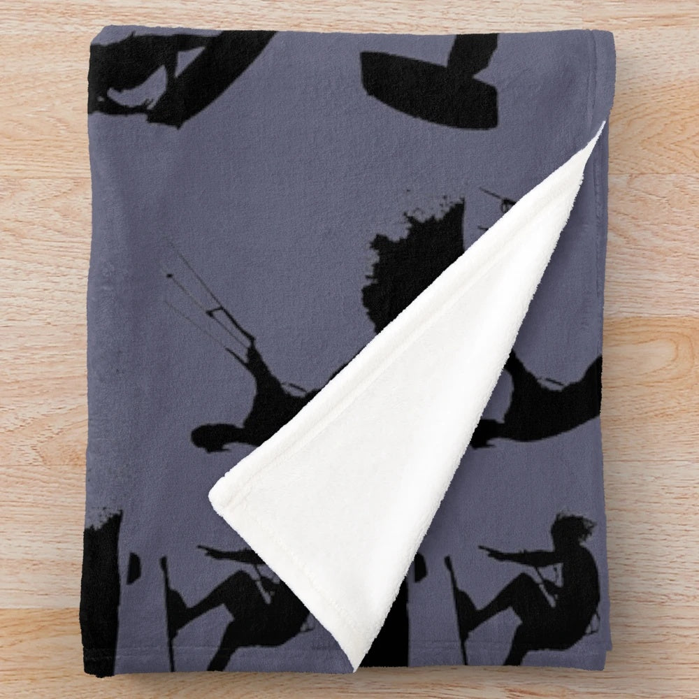 Kite surf silhouette pattern on a plush black and white blanket