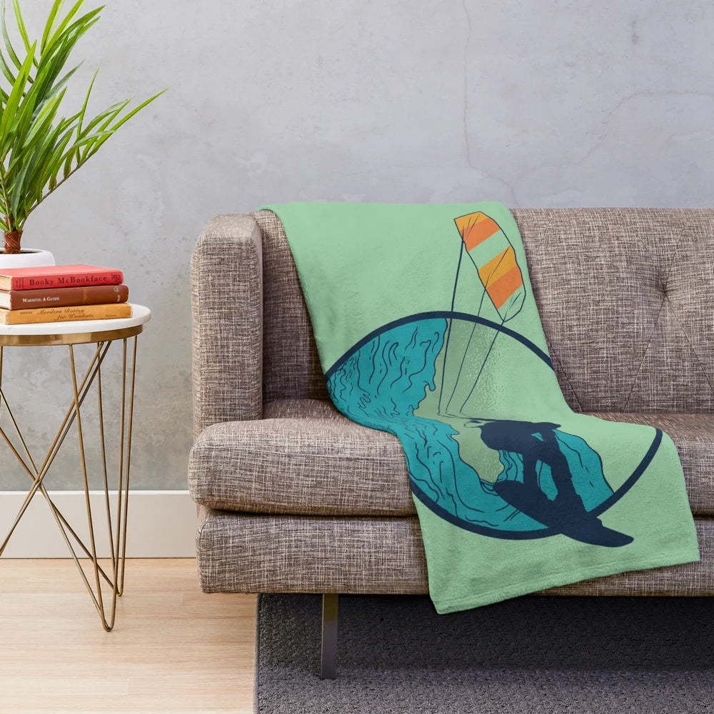 Kite surfer silhouette catching waves on a plush blanket