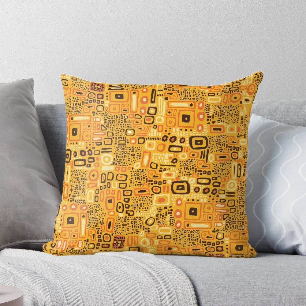 Klimt-inspired decorative pillow with an intricately patterned design in rich amber, gold, and yellow tones.