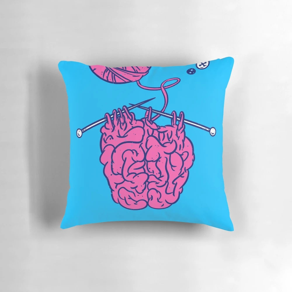Cozy knitted brain shaped pillow in pink and white colors