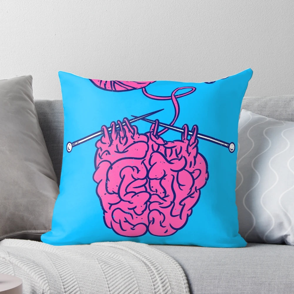 Cozy knitted brain shaped pillow in pink and white colors