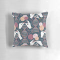 A decorative pillow featuring a knitted DNA double helix design in shades of blue, bordeaux, and pink.
