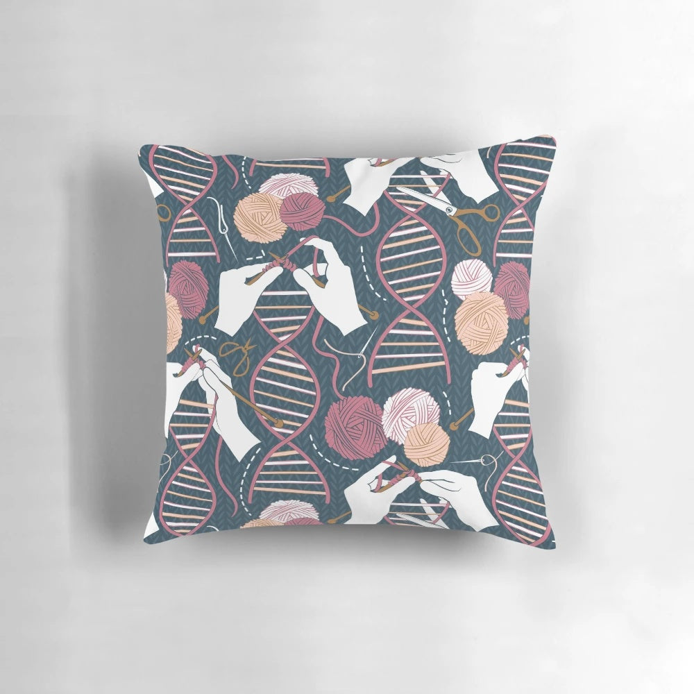 A decorative pillow featuring a knitted DNA double helix design in shades of blue, bordeaux, and pink.