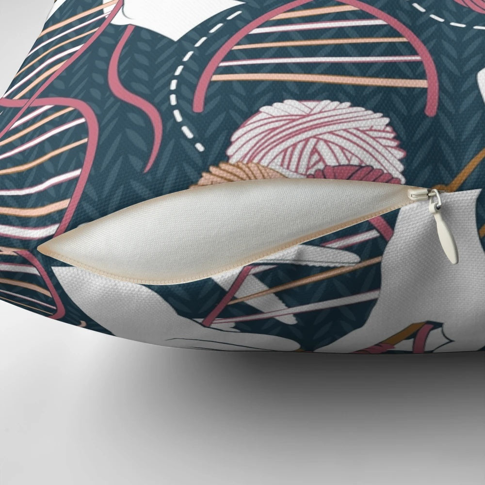 A decorative pillow featuring a knitted DNA double helix design in shades of blue, bordeaux, and pink.