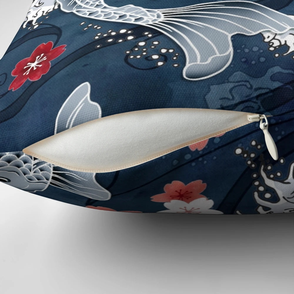 Blue pillow featuring a watercolor design of koi fish swimming among cherry blossoms