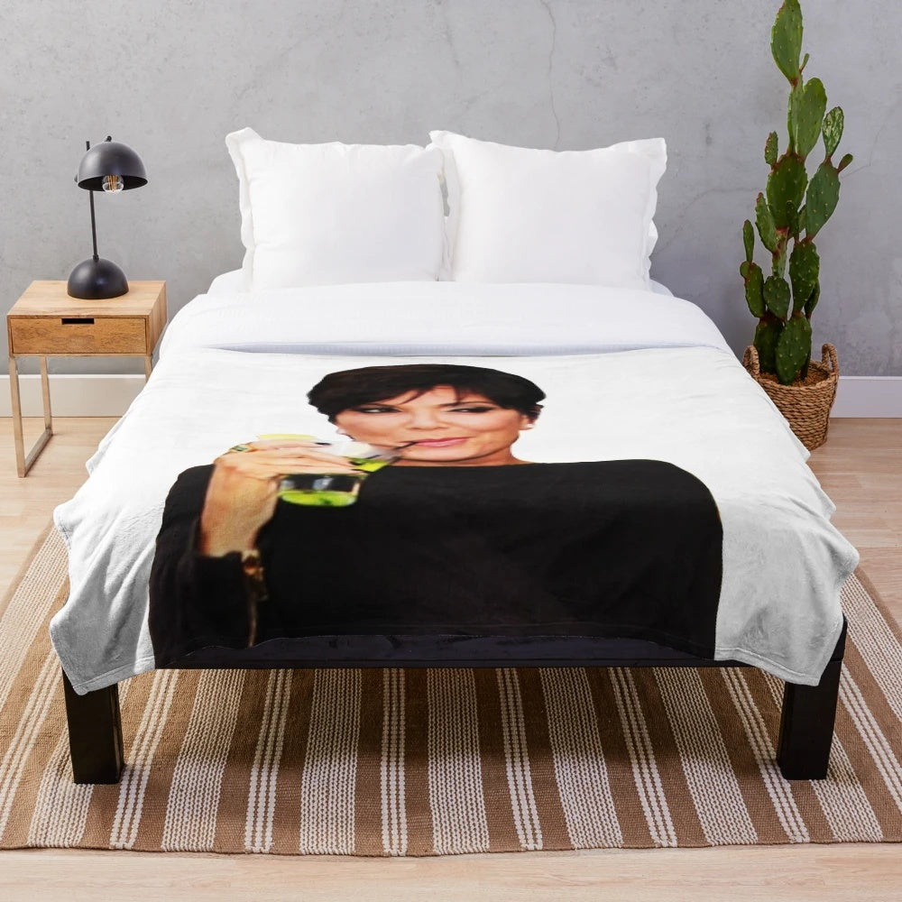 Kris Jenner-inspired plush blanket featuring a collage design of pop culture references