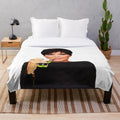 Kris Jenner-inspired plush blanket featuring a collage design of pop culture references