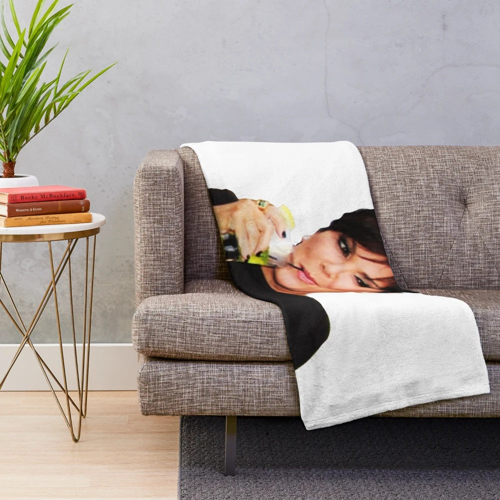 Kris Jenner-inspired plush blanket featuring a collage design of pop culture references