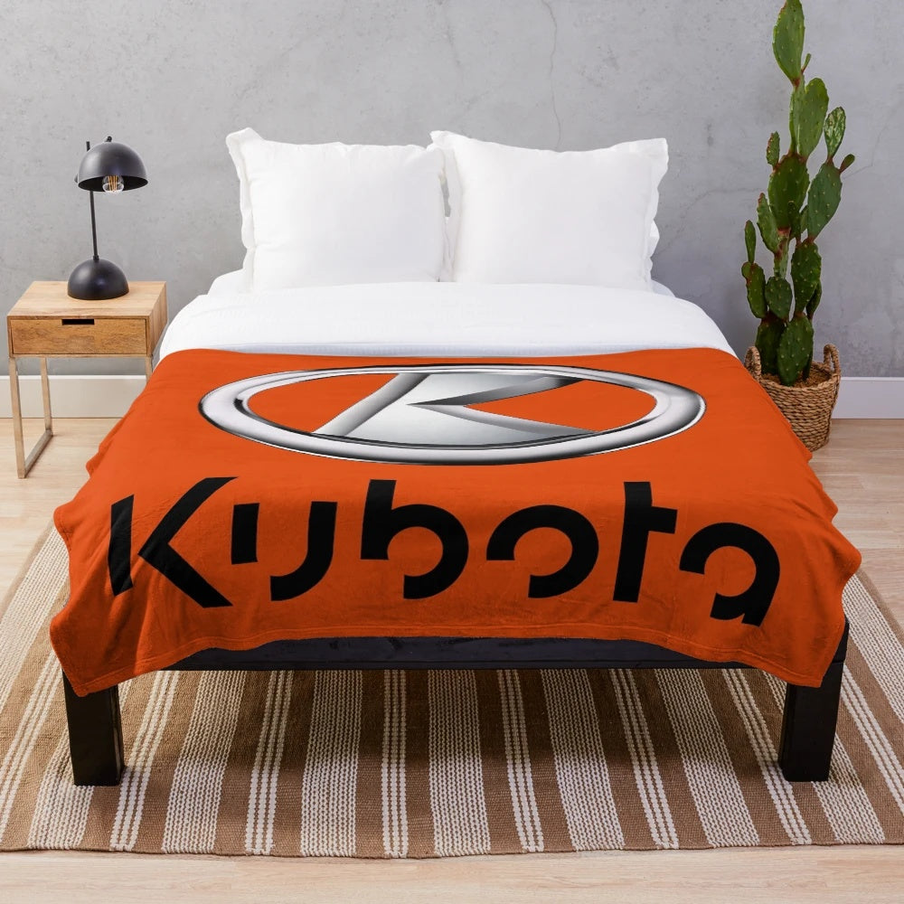 Kubota-inspired plush blanket with tractor logo