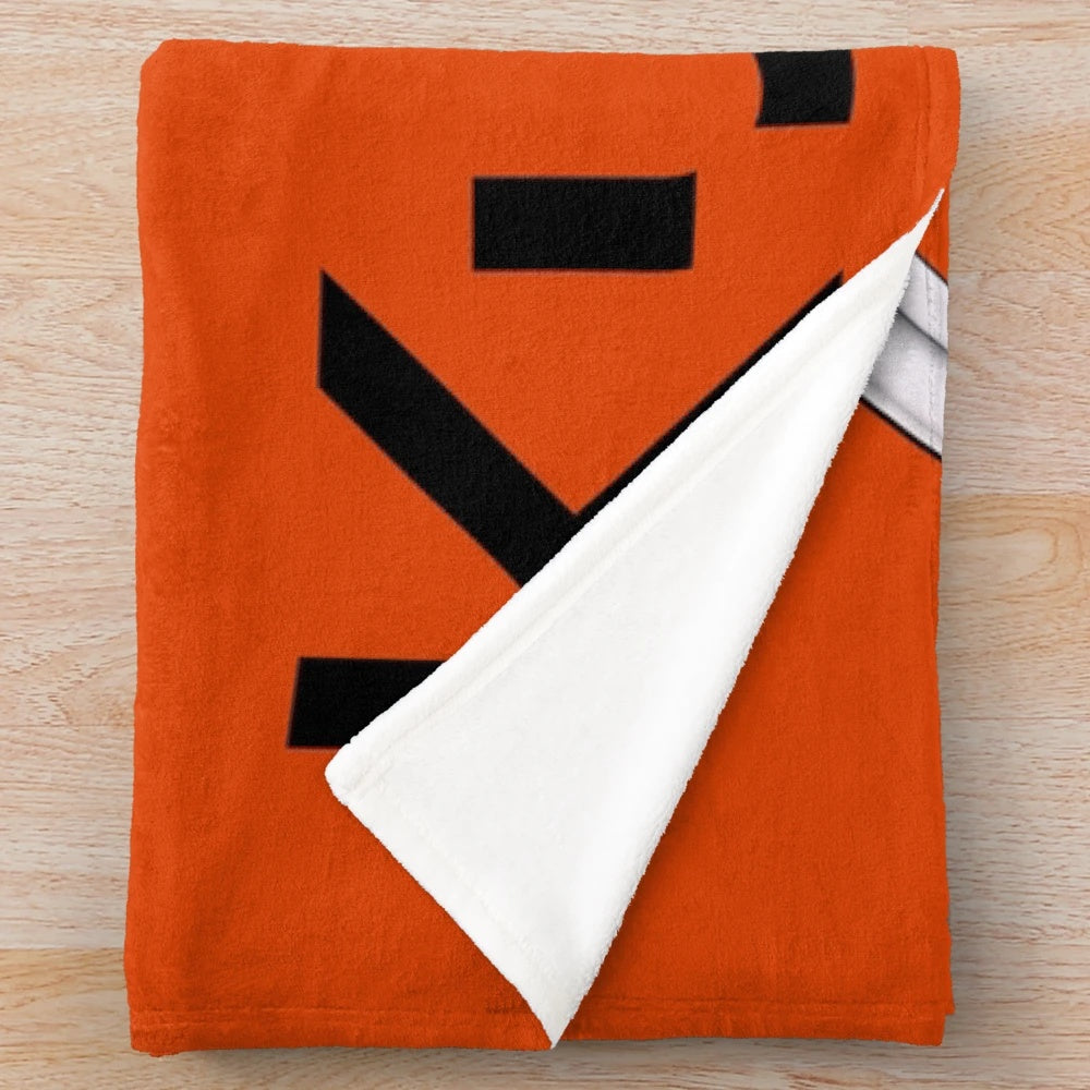 Kubota-inspired plush blanket with tractor logo