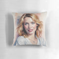 A plush, decorative pillow featuring the image of Australian singer and actress Kylie Minogue.