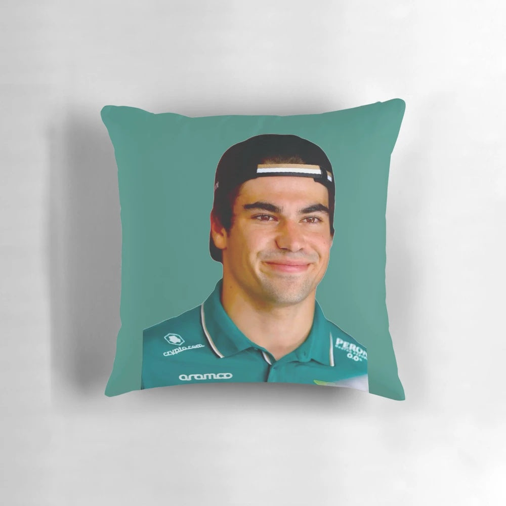 Lance Stroll, F1 driver for the Aston Martin F1 team, smiling in his racing suit.