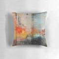 Large blue and orange abstract landscape art printed on a decorative throw pillow