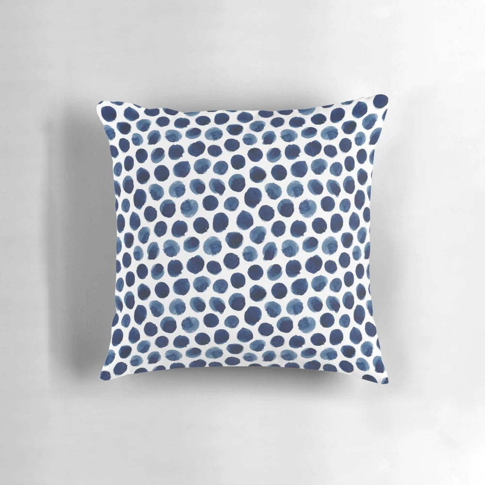 Large blue and white watercolor polka dot patterned decorative throw pillow