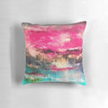 Large decorative abstract art pillow in shades of pink, teal, and fuchsia