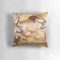 Pillow featuring a reproduction of the Lascaux Hall of the Bulls cave painting, depicting deer and aurochs from the Paleolithic era.