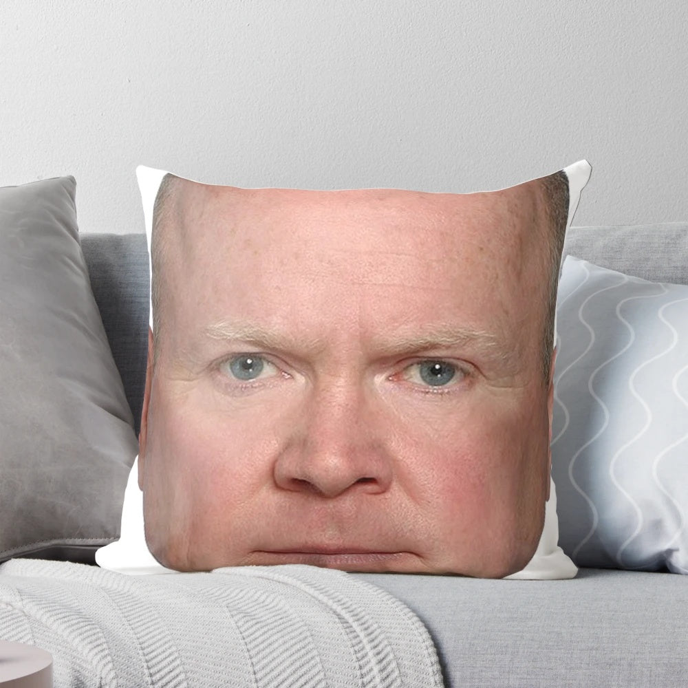 A plush, square pillow featuring the face of Phil Mitchell, a beloved character from the TV show Eastenders.