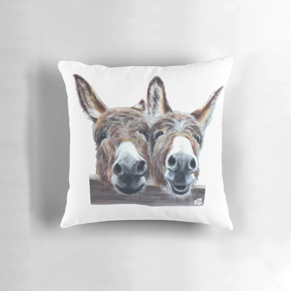 Colorful pastel illustration of a laughing donkey on a soft, plush pillow