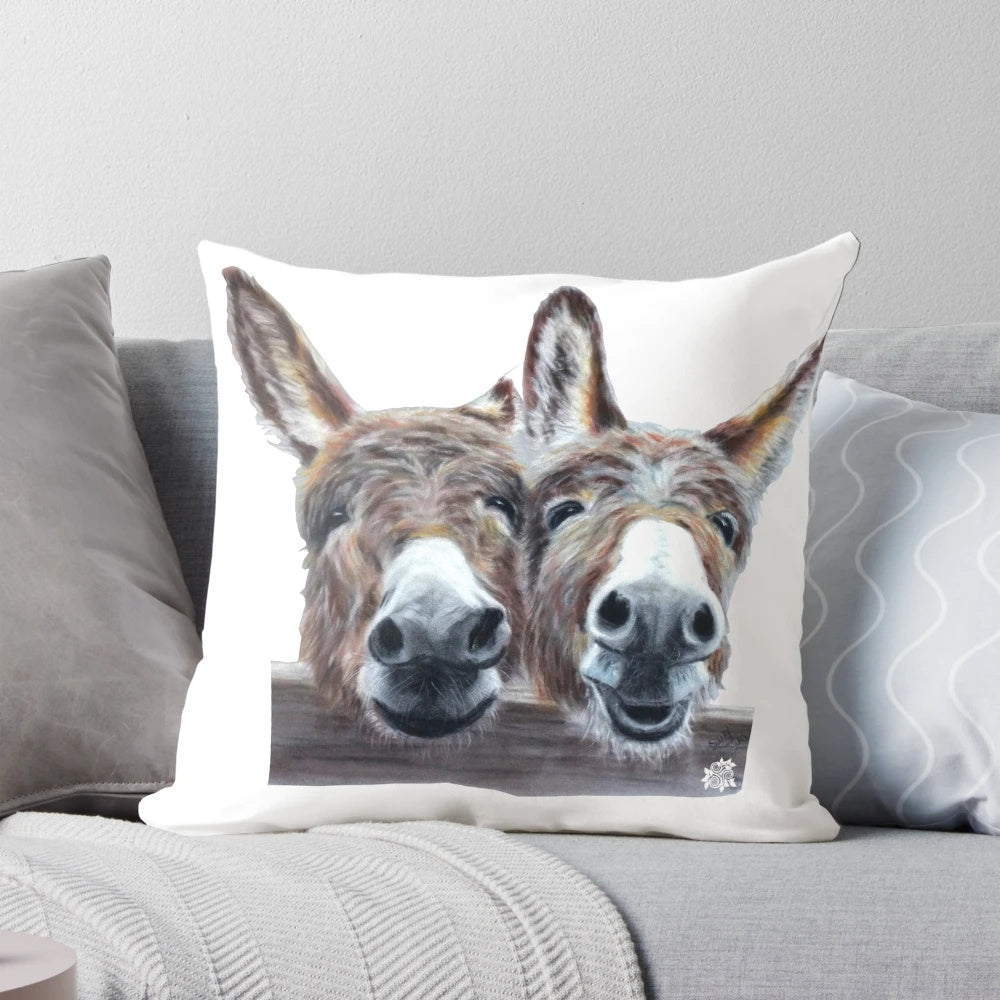 Colorful pastel illustration of a laughing donkey on a soft, plush pillow