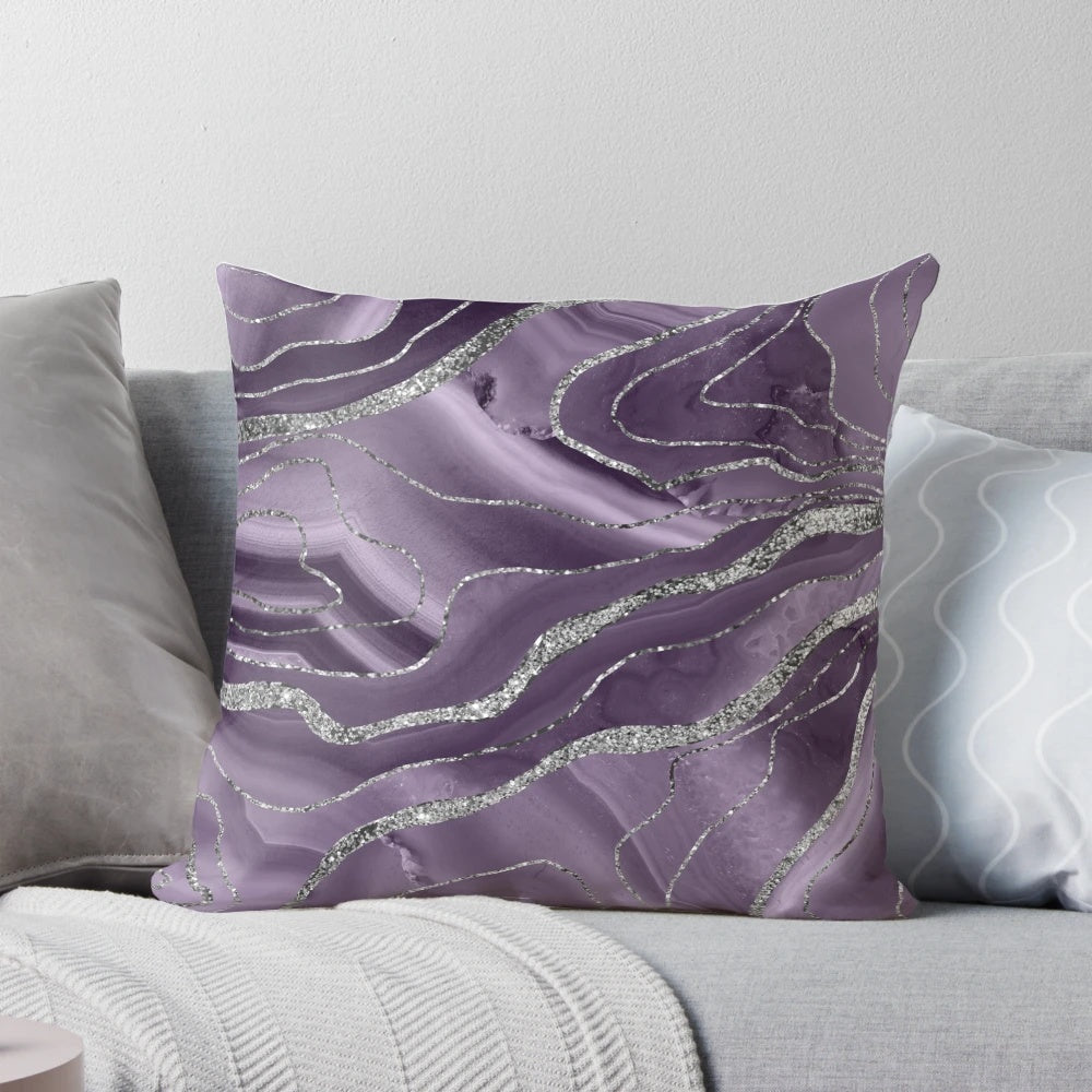 Closeup of a lavender agate glitter throw pillow with a modern, abstract design