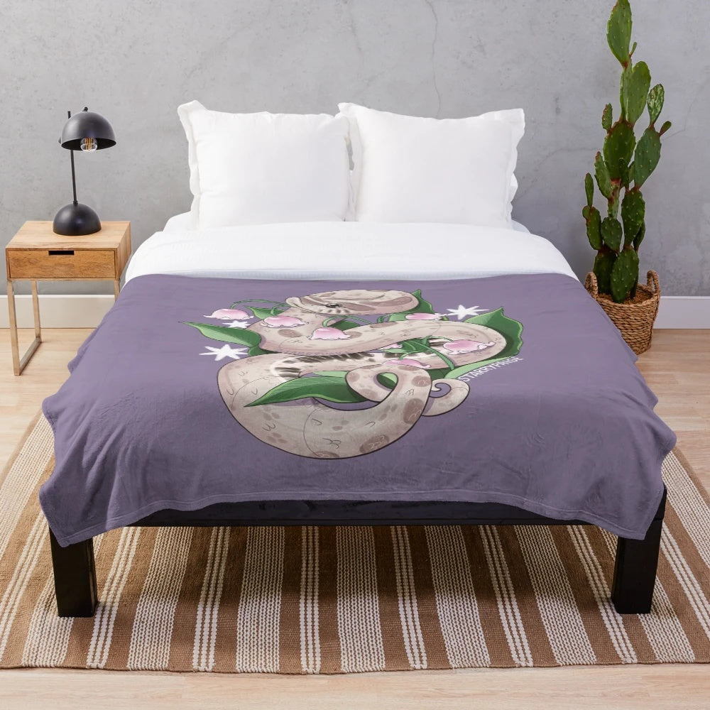Lavender hognose snake plush blanket with lily of the valley design
