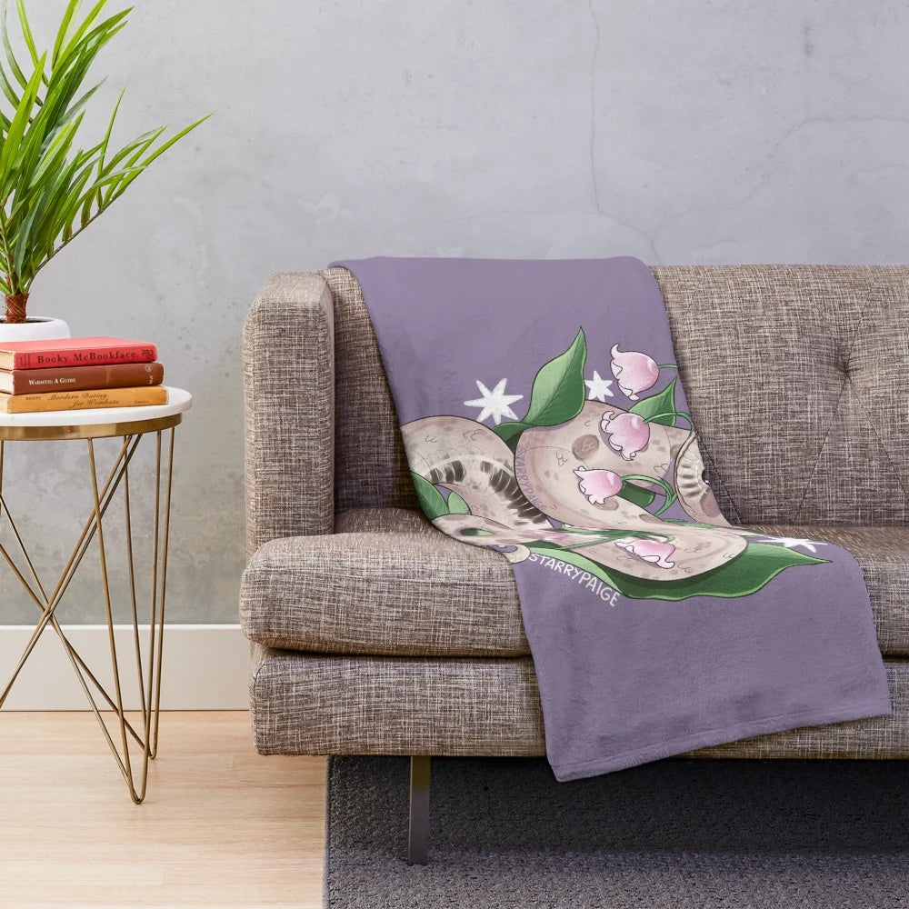 Lavender hognose snake plush blanket with lily of the valley design