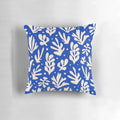 Colorful leaves and plants in a Matisse-inspired pattern on a decorative throw pillow