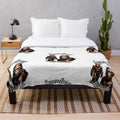 Plush blanket with colorful illustrations of legendary animals like Bigfoot, Sasquatch, and Yeti
