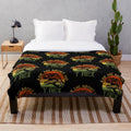 Plush blanket featuring a legendary T-Rex design for dinosaur enthusiasts