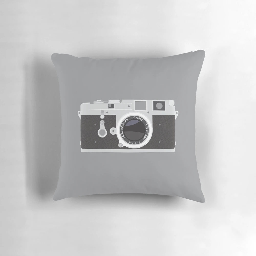 A soft, stylish Leica camera-inspired pillow for photography enthusiasts