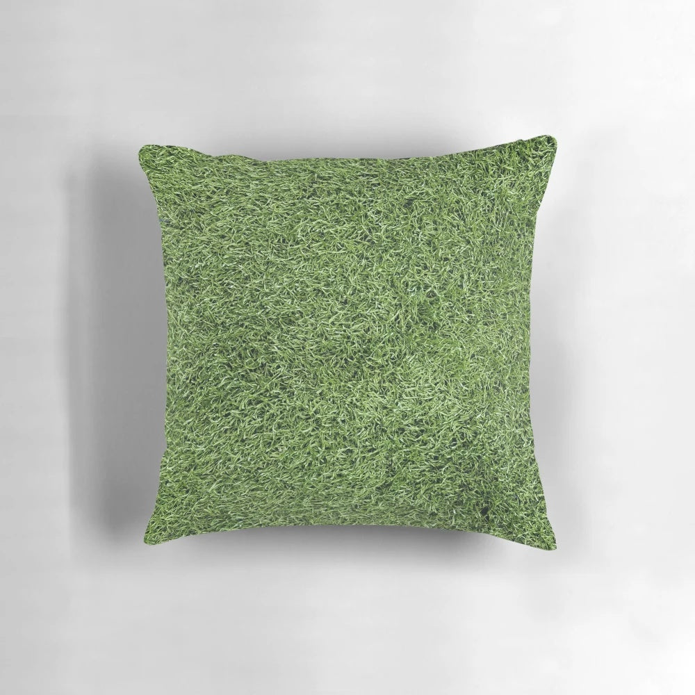 Plush pillow with realistic astroturf texture and lush green color, perfect for sports-themed decor.
