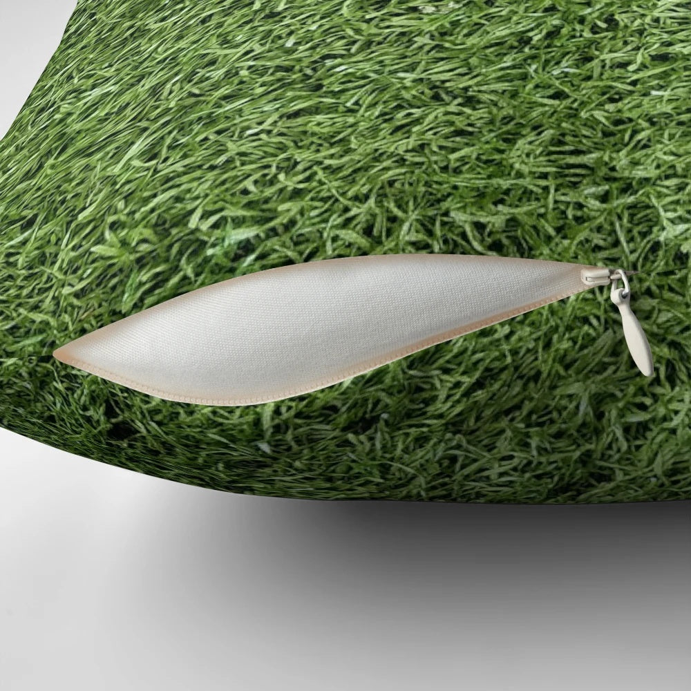 Plush pillow with realistic astroturf texture and lush green color, perfect for sports-themed decor.