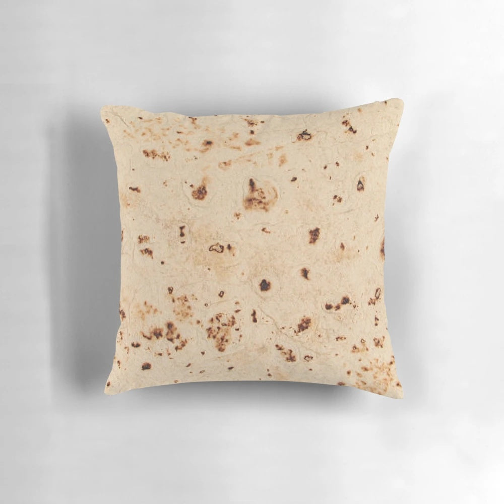 Realistic-looking tortilla-shaped pillow for a unique Mexican-themed home decor accent.