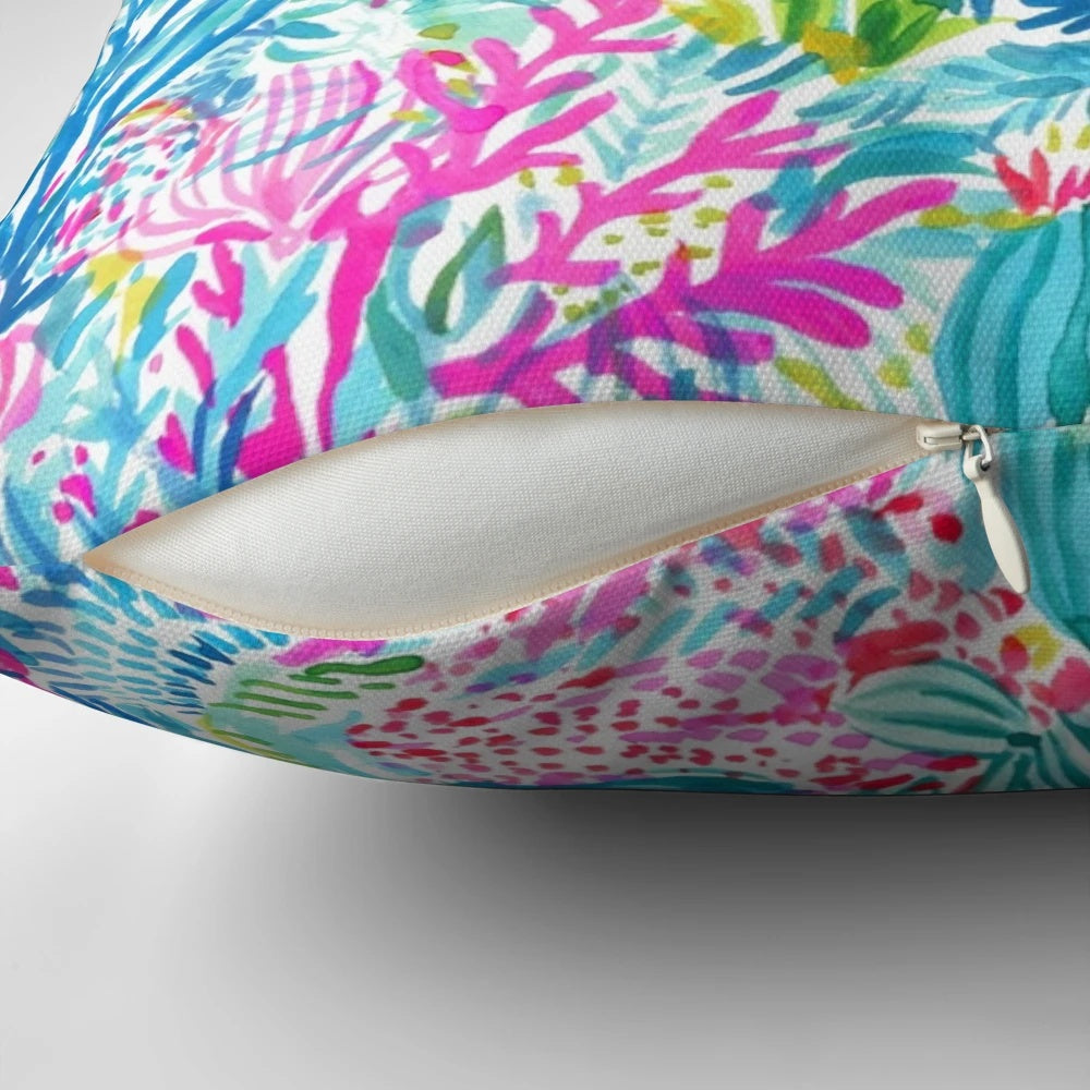 Lilly Pulitzer inspired pillow with a summer lily and ocean holiday design