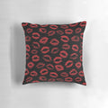 A pillow featuring a repeating pattern of red lipstick marks, creating a textured, seamless design.