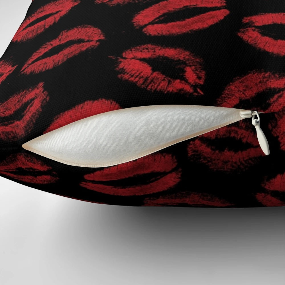 A pillow featuring a repeating pattern of red lipstick marks, creating a textured, seamless design.