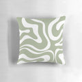 Liquid swirl abstract pattern in sage green and white on a plush pillow